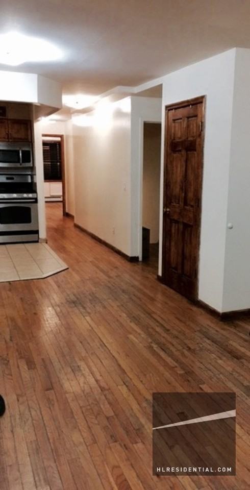 70-01 67th Pl 1 - Photo 2 of 14