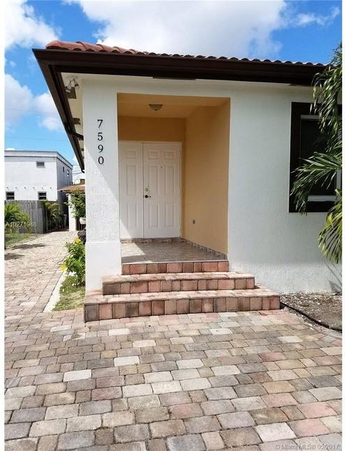 7590 NW S River Dr - Photo 2 of 8