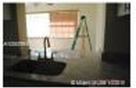 8670 NW 28th Pl - Photo 3 of 8