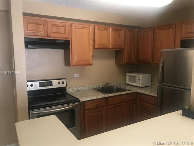 7080 NW 179th St #103 - Photo 3 of 15