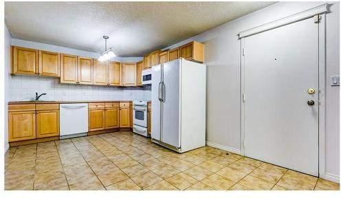 1528 11 Ave SW #104 - Photo 2 of 7