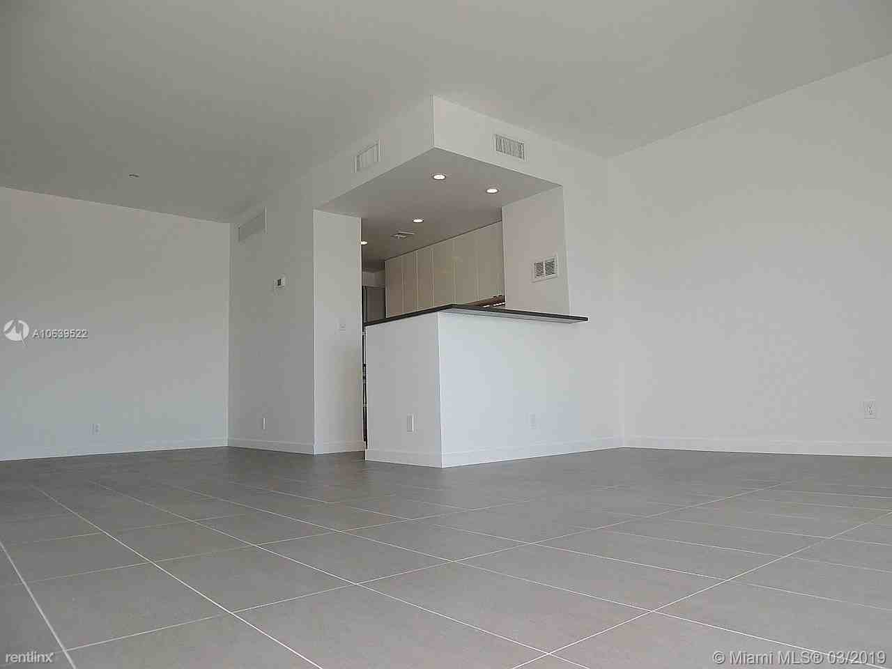 880 NE 69th St - Photo 3 of 4