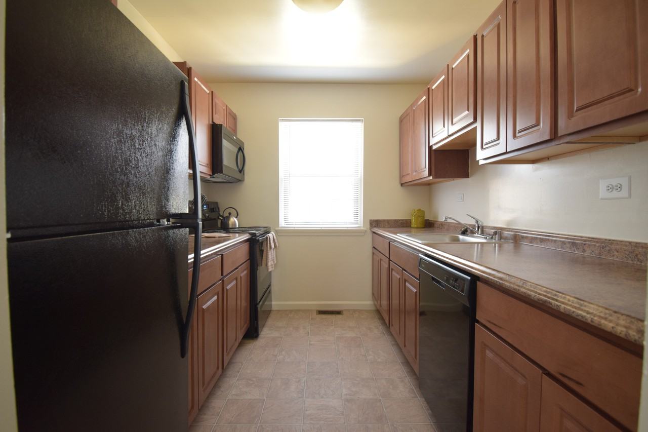 Stansbury Manor Apartments & Townhomes - Photo 2 of 24