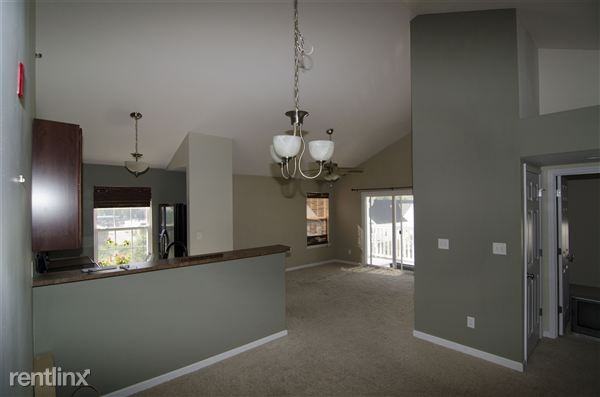 Gorgeous 2 Bed/2 Bath Top Floor Condo with Vaulted Ceilings - Photo 3 of 9