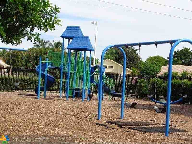 8701 Wiles Rd 108 - Photo 2 of 10