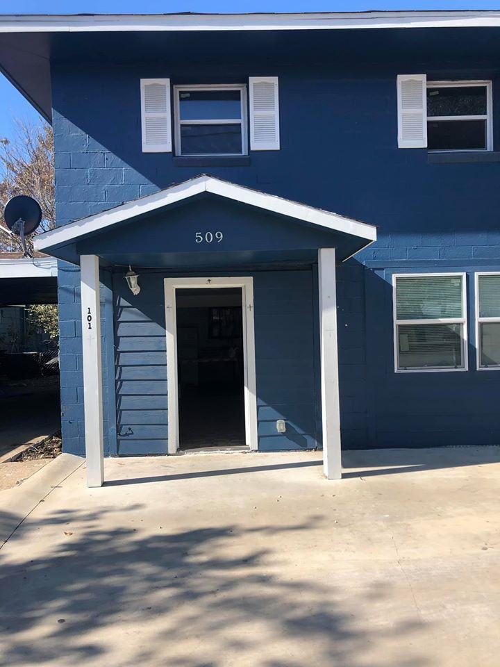 2-story blue building - Photo 2 of 4