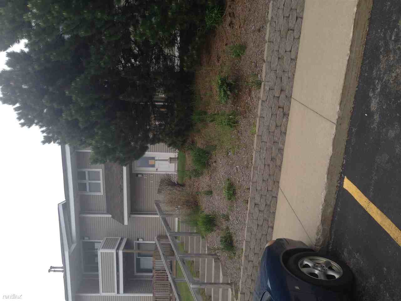 Whispering Wind Apartments - Photo 2 of 2