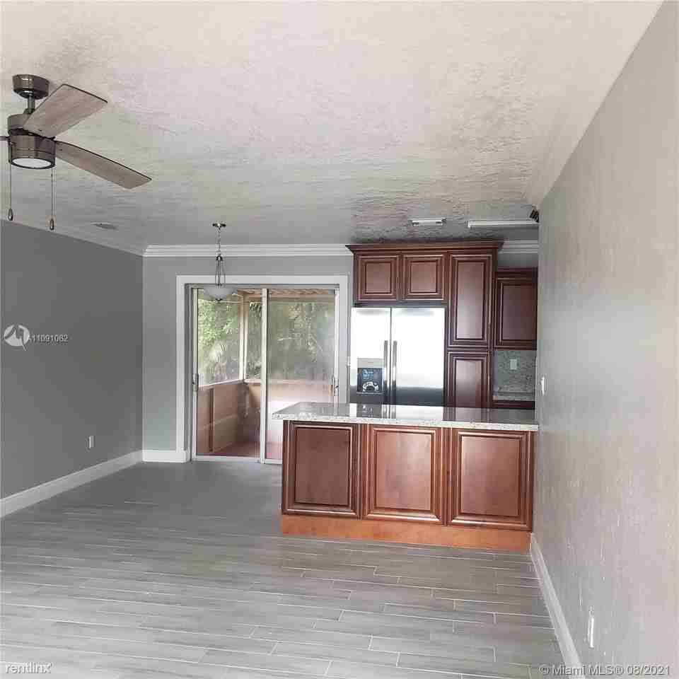 6901 Raleigh St - Photo 3 of 14