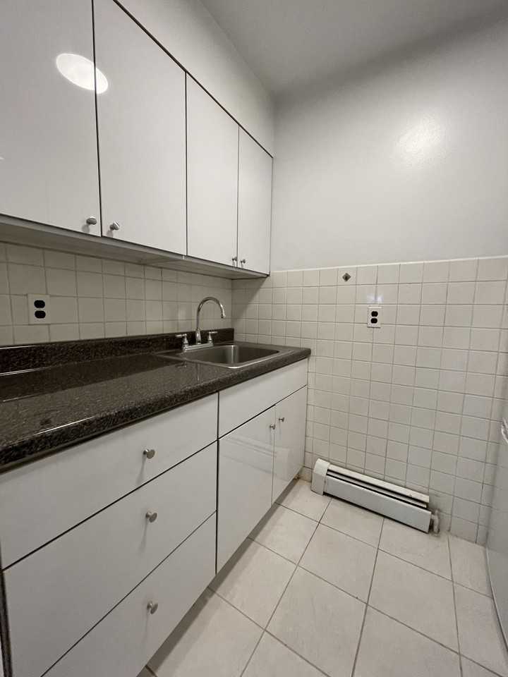 Santom Realty Corp. - Photo 2 of 9