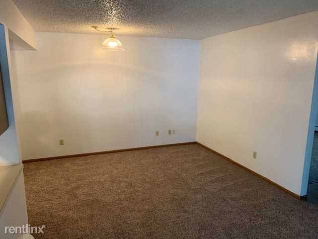 Village Apartments - Photo 2 of 6