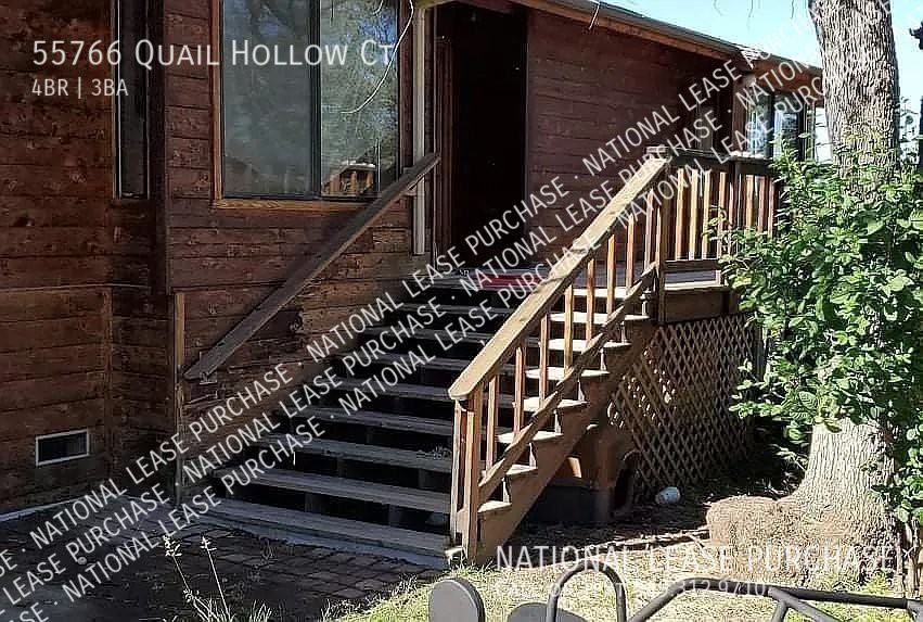 55766 Quail Hollow Ct - Photo 3 of 5