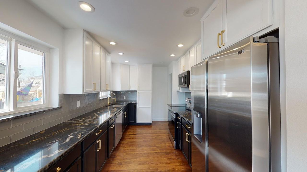 Classic brick Montclair home with covered patio & fenced yard