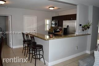 1001 Ne 166th St - Photo 3 of 21