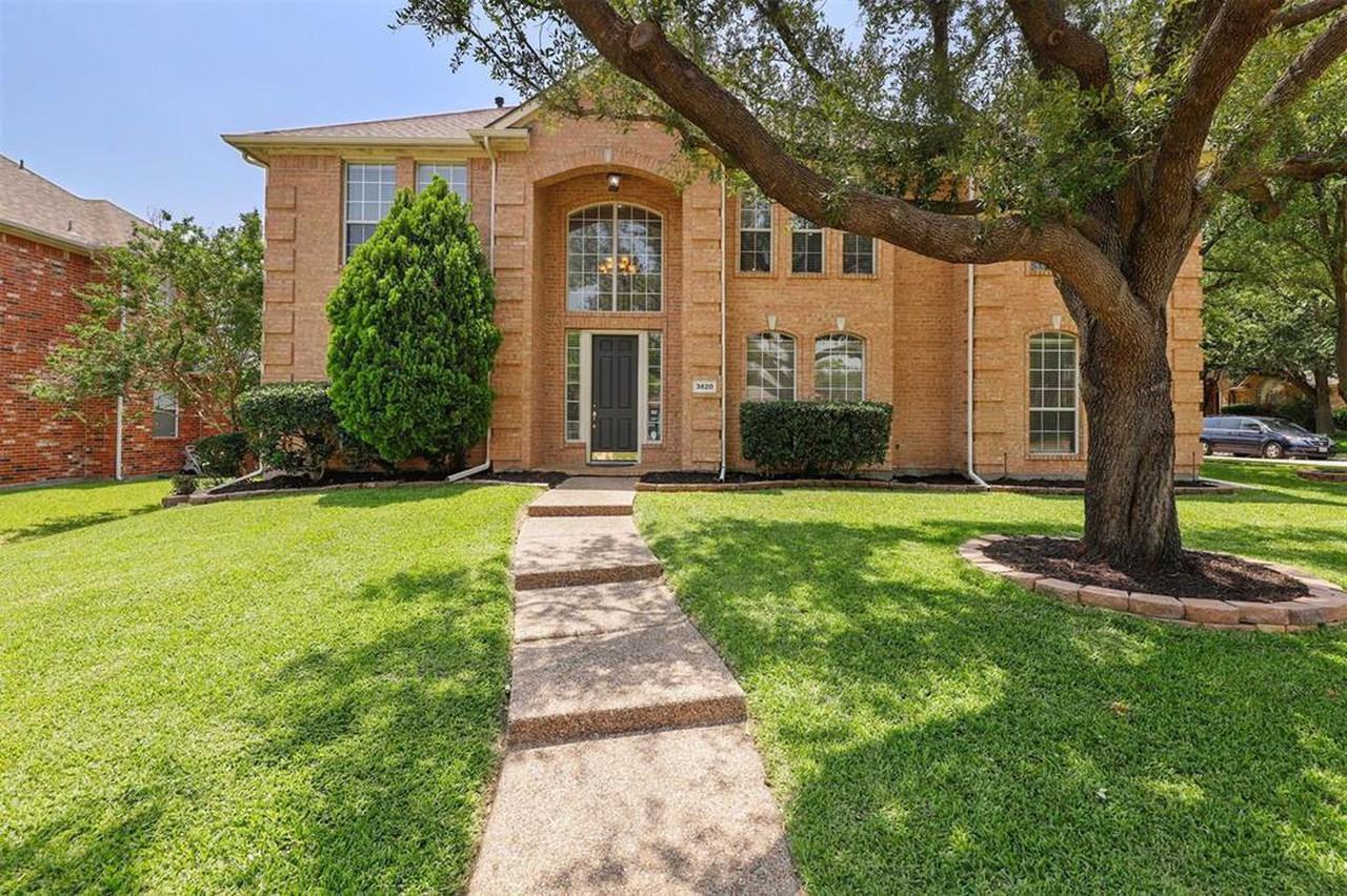Classic Plano brick home with large fenced yard on corner lot