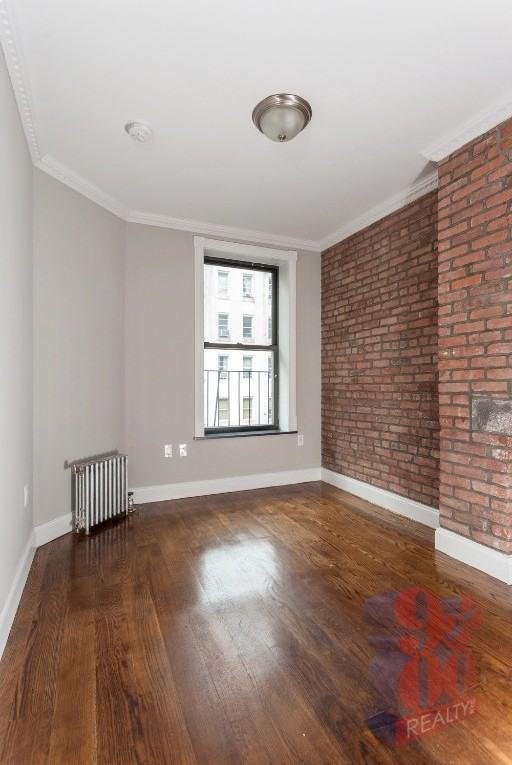 E 9th St #7 - Photo 4 of 5