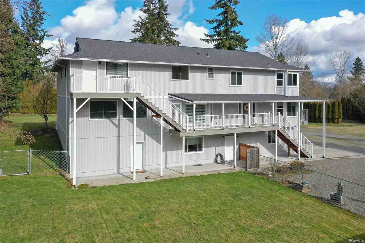 Expansive 3 level private gated home sits on +/-4.94 acres with a pond and beautiful view of Mount R - Photo 2 of 9