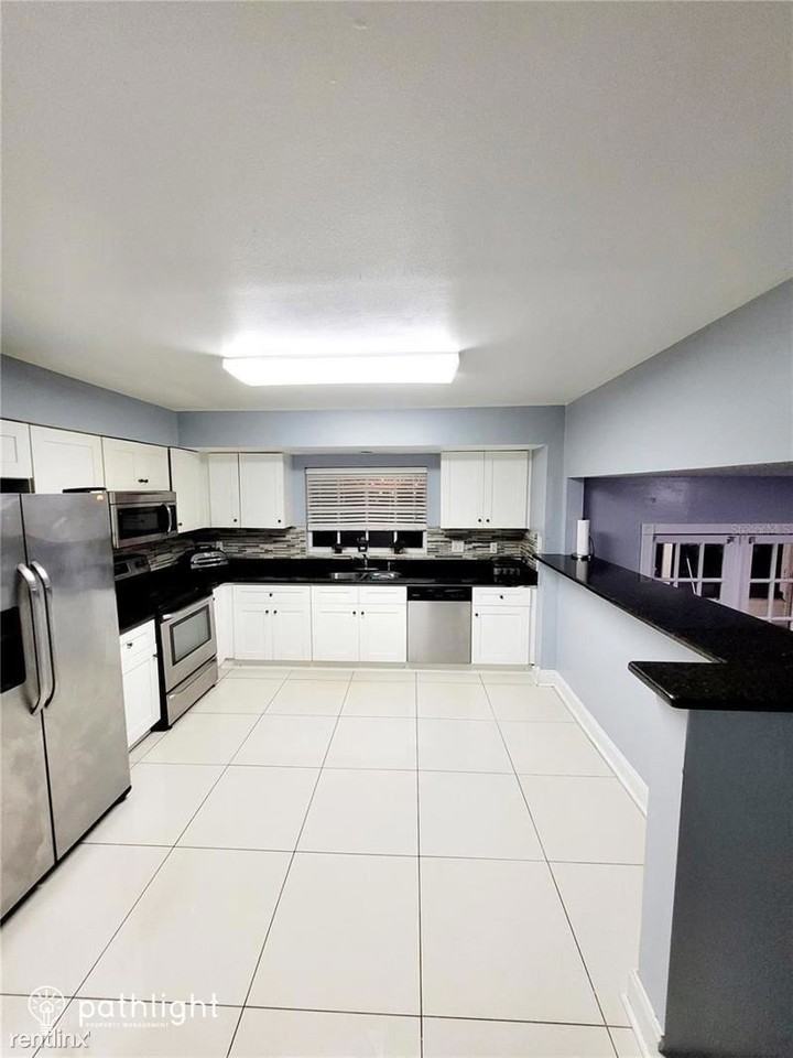 7613 Rustic Dr - Photo 2 of 10