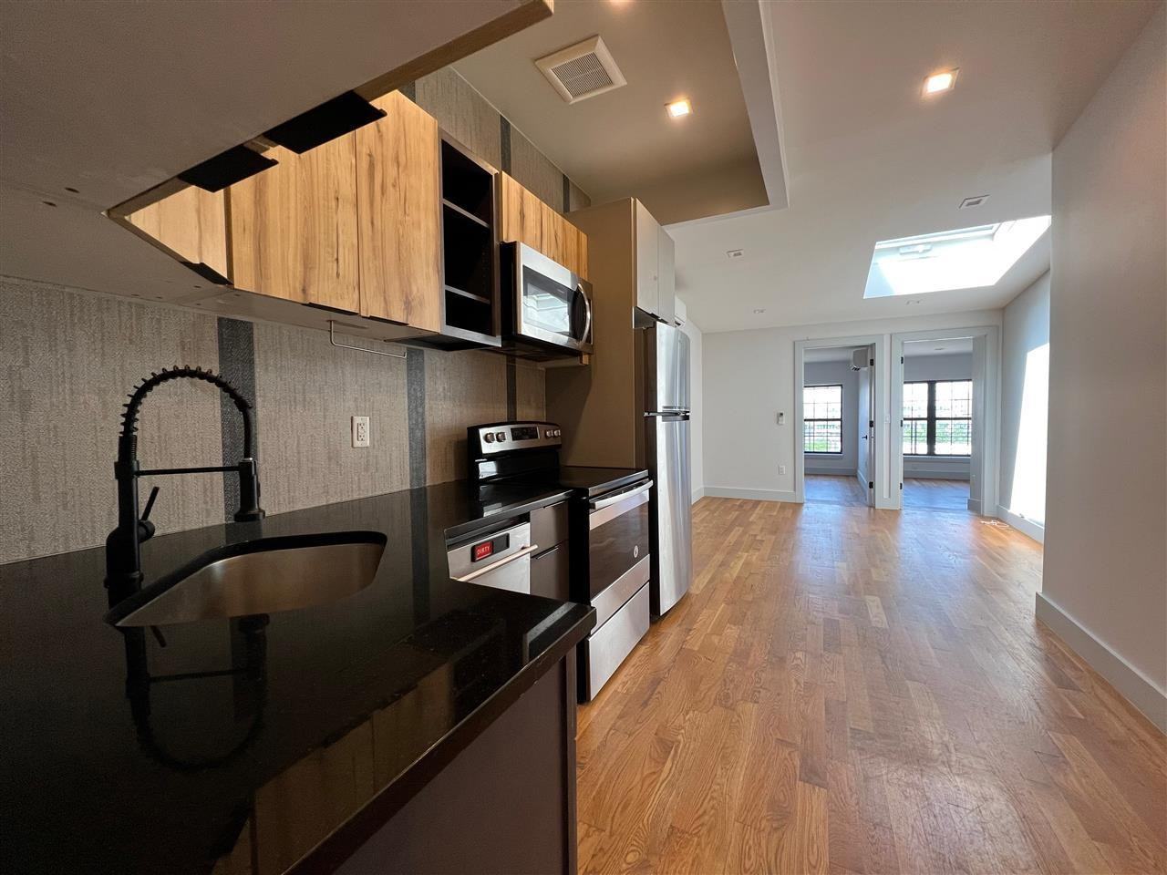 241 Scholes St #3L - Photo 2 of 16