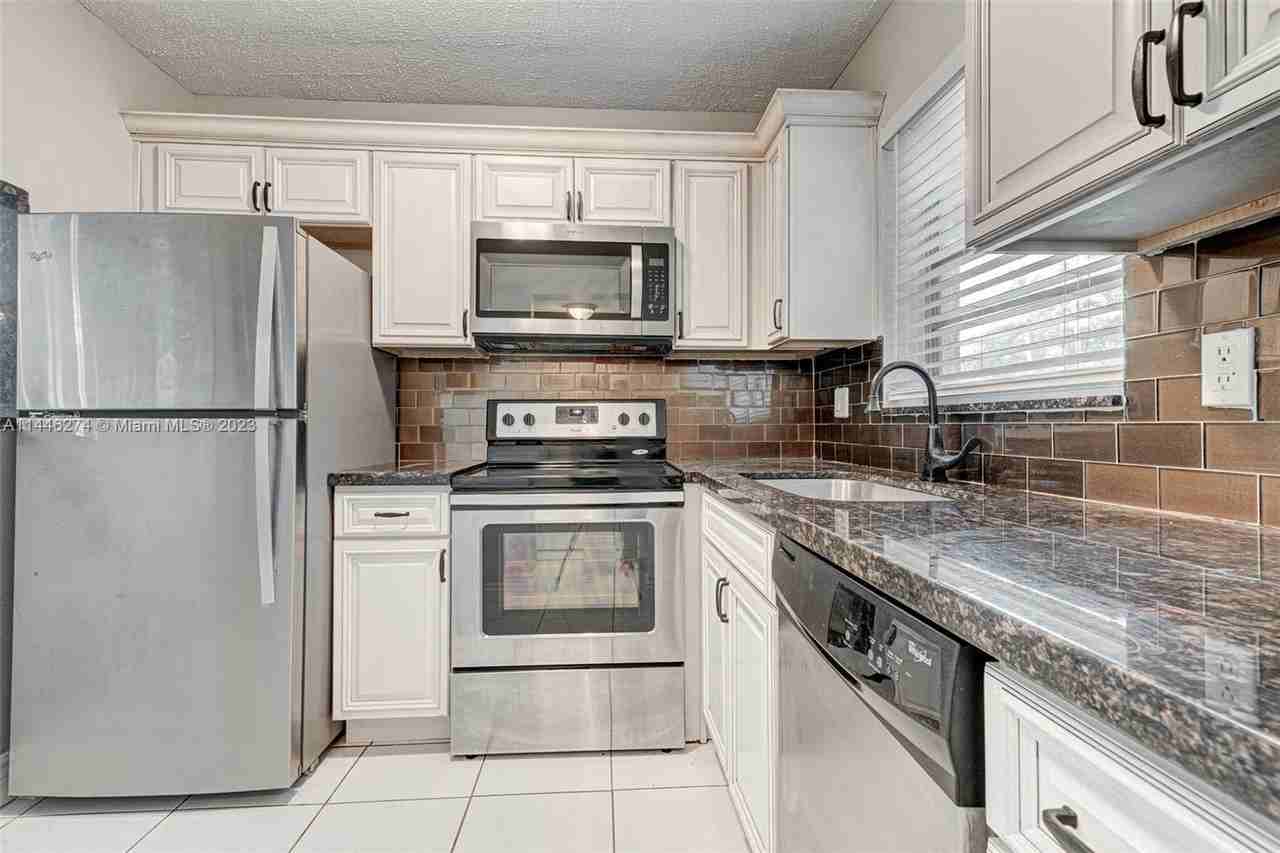 3048 Sunrise Lakes Dr E #113 - Photo 2 of 8