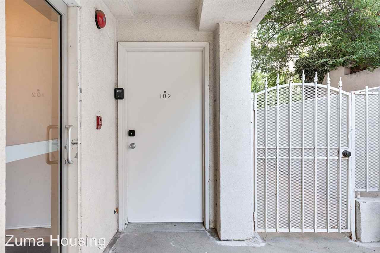 A 6 bedroom, 2 bathroom apartment with common areas and a fully functional kitchen at 10777 Ashton Ave. Unit 102 - Photo 3 of 50