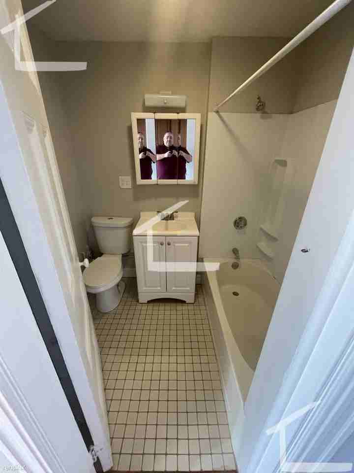 52 JFK St - Photo 2 of 4