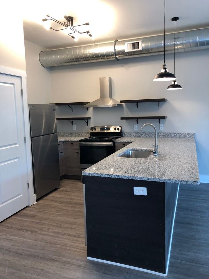 The Warehouse Apartments - Photo 5 of 48