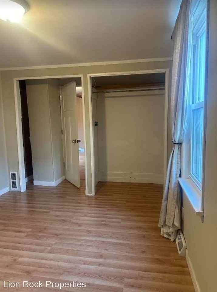 Experience Tranquil Nights in a Serene Bedroom on California Street Northeast - Photo 2 of 28