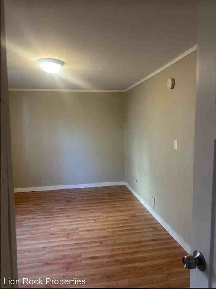 Experience Tranquil Nights in a Serene Bedroom on California Street Northeast - Photo 3 of 28