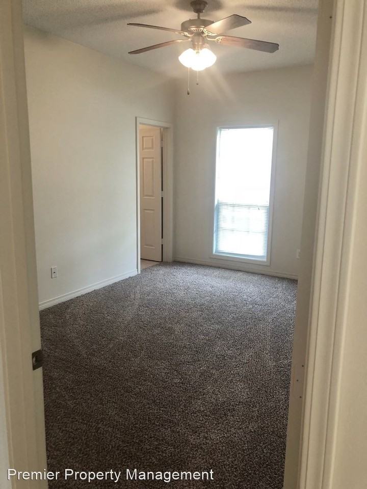 Duplex with covered carport - Photo 2 of 9