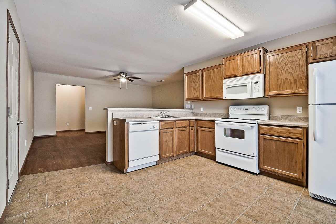 Stonegate Duplexes - Photo 2 of 14