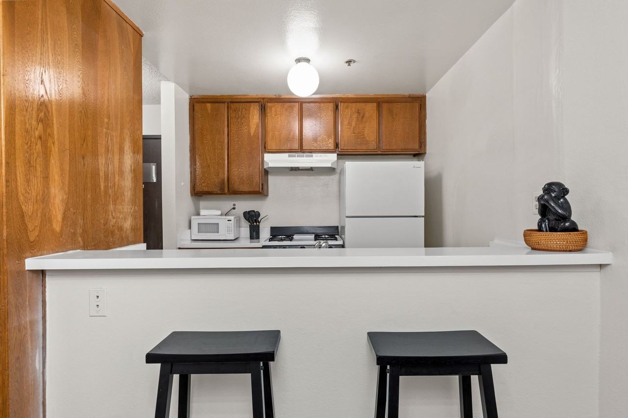 A 3 Bedroom apartment with Private & Common Bathrooms, common areas and a fully functional kitchen at 655 Kelton Ave. - Photo 3 of 7