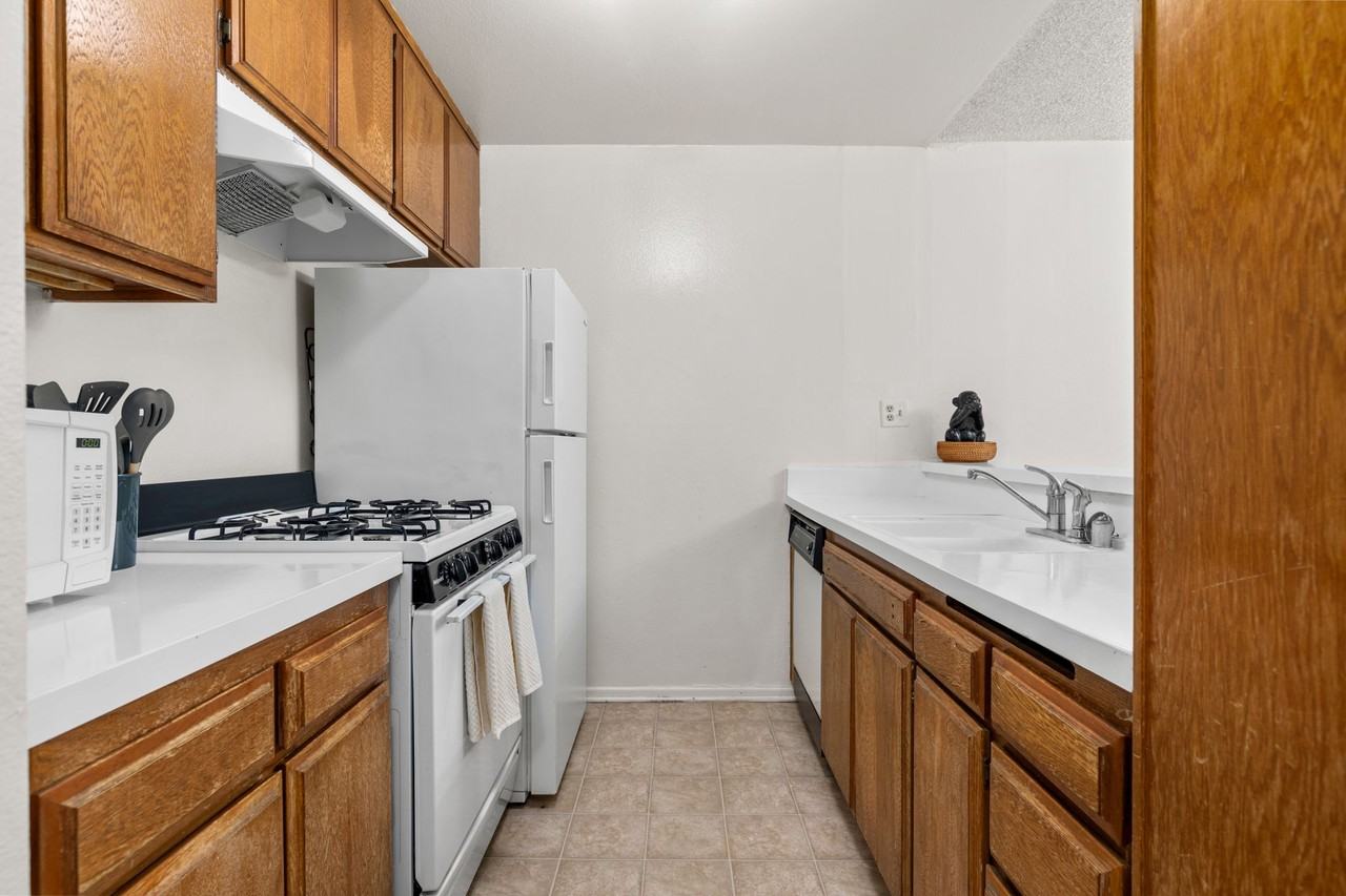 A 3 Bedroom apartment with Private & Common Bathrooms, common areas and a fully functional kitchen at 655 Kelton Ave. - Photo 4 of 7