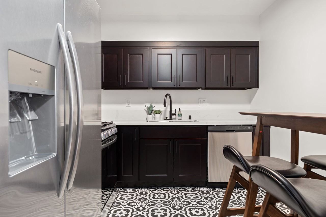 A 4 bedroom, 3 bathroom apartment with a dining room & a fully functional kitchen at 10793 Ohio Ave. - Photo 2 of 49