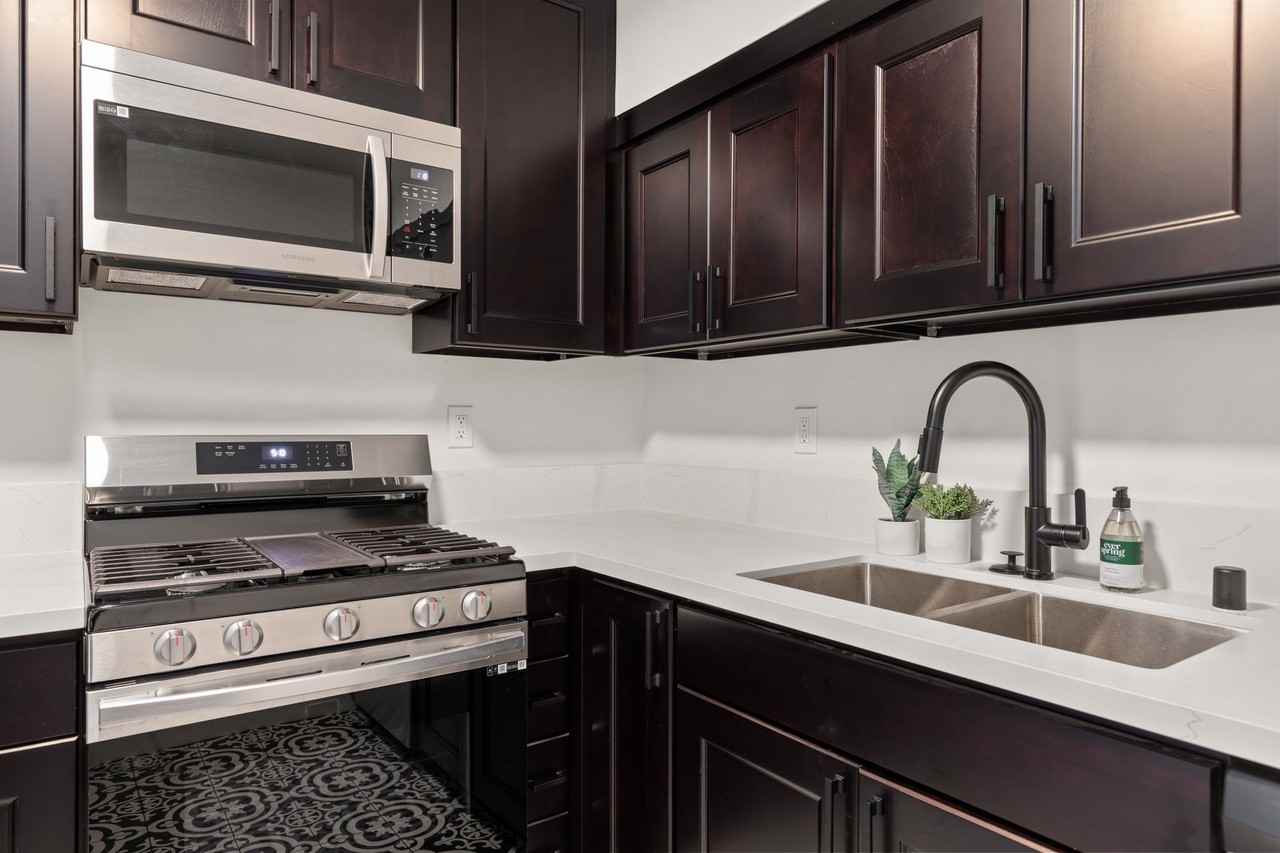 A 4 bedroom, 3 bathroom apartment with a dining room & a fully functional kitchen at 10793 Ohio Ave. - Photo 6 of 49