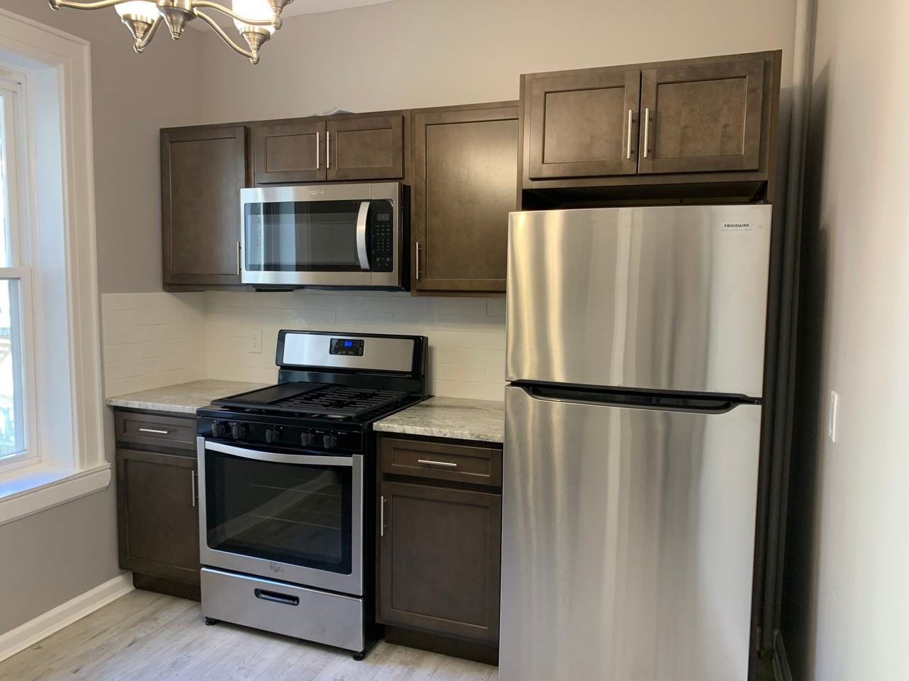 Full Renovations, SS appliances, New Bath, HW Floors - Photo 3 of 7