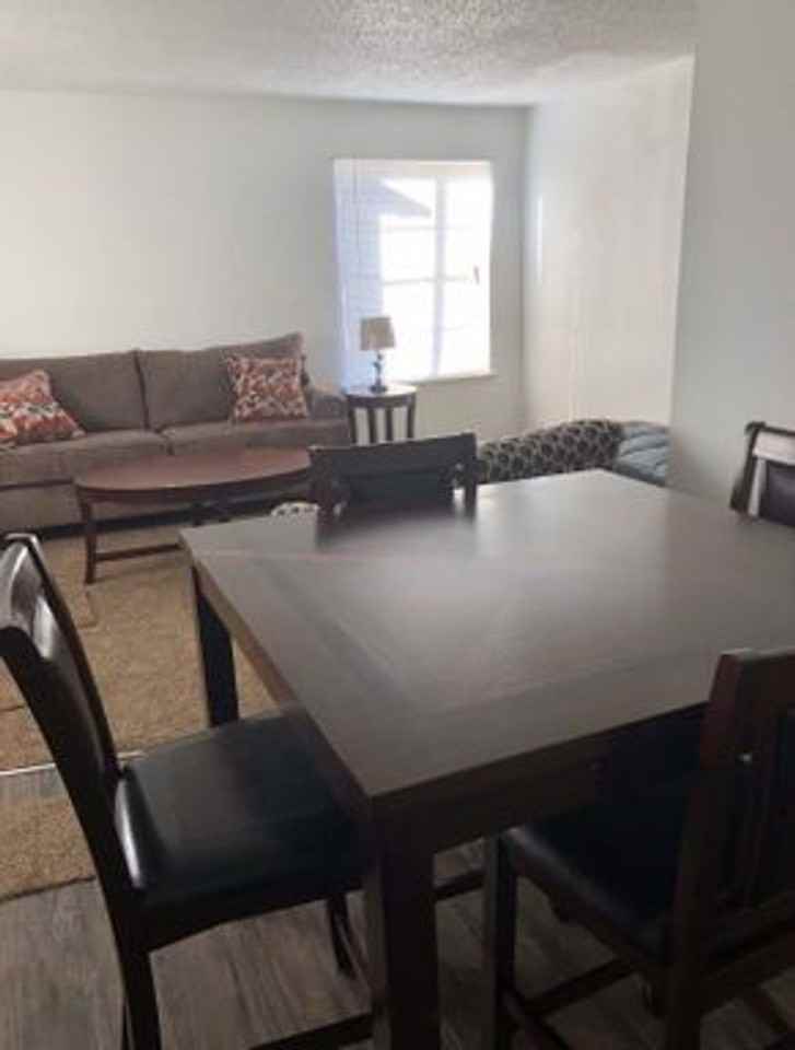 CARRIAGE HOUSE APARTMENTS - Photo 4 of 17