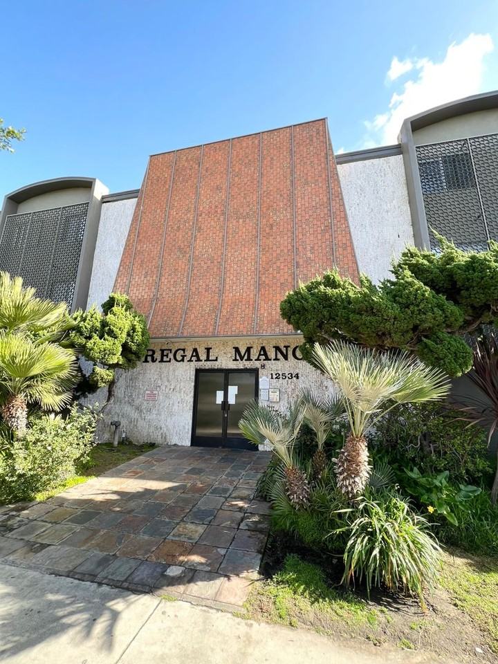 REGAL MANOR - Photo 2 of 14