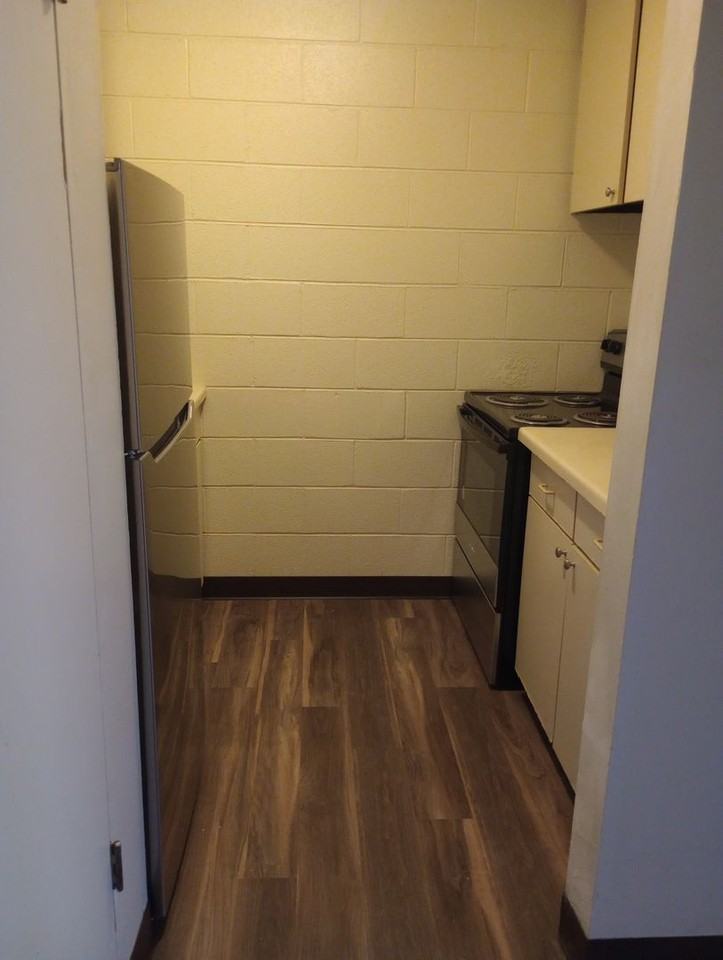 THE QUADS APARTMENTS - Photo 5 of 7