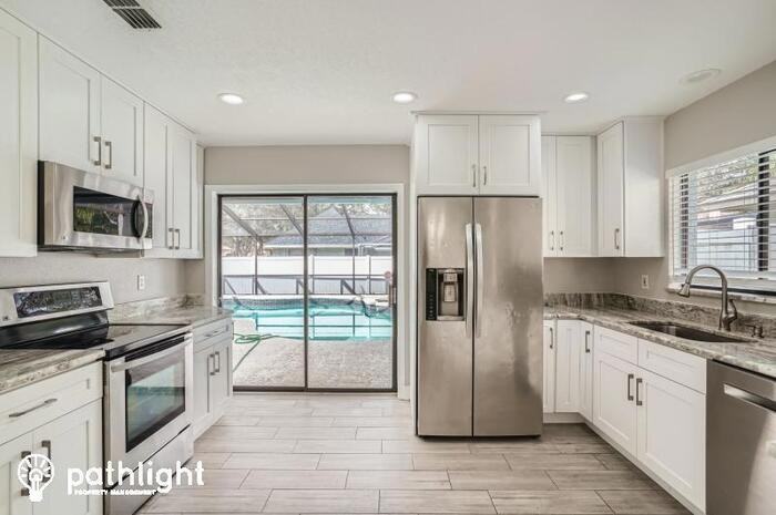 9406 Pebble Glen Ave - Photo 2 of 16