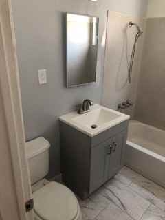 PARAMOUNT APARTMENTS - Photo 2 of 7