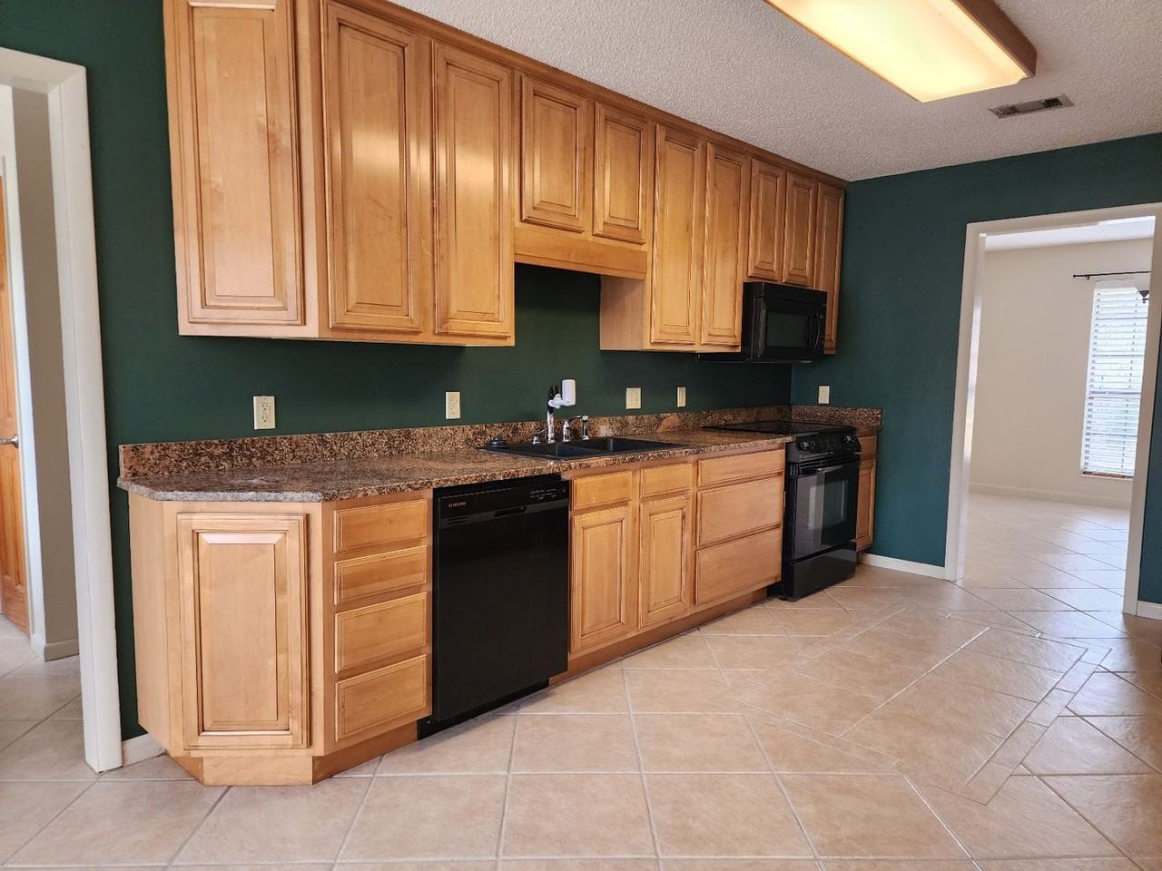 9001 Woodrun Rd - Photo 3 of 25