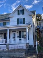 featured image of 211 W 4th St