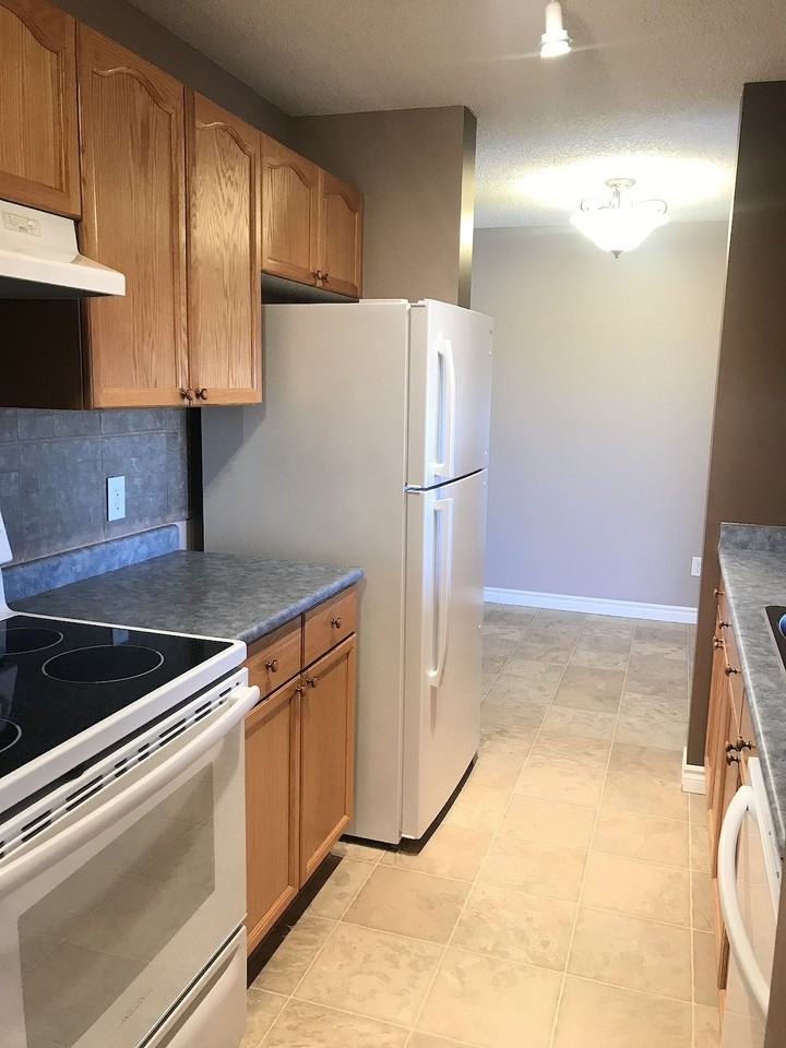 Bright and clean 2 bed  2 bath condo in Ft. Sask*Parking Included*4th Floor - Photo 3 of 19