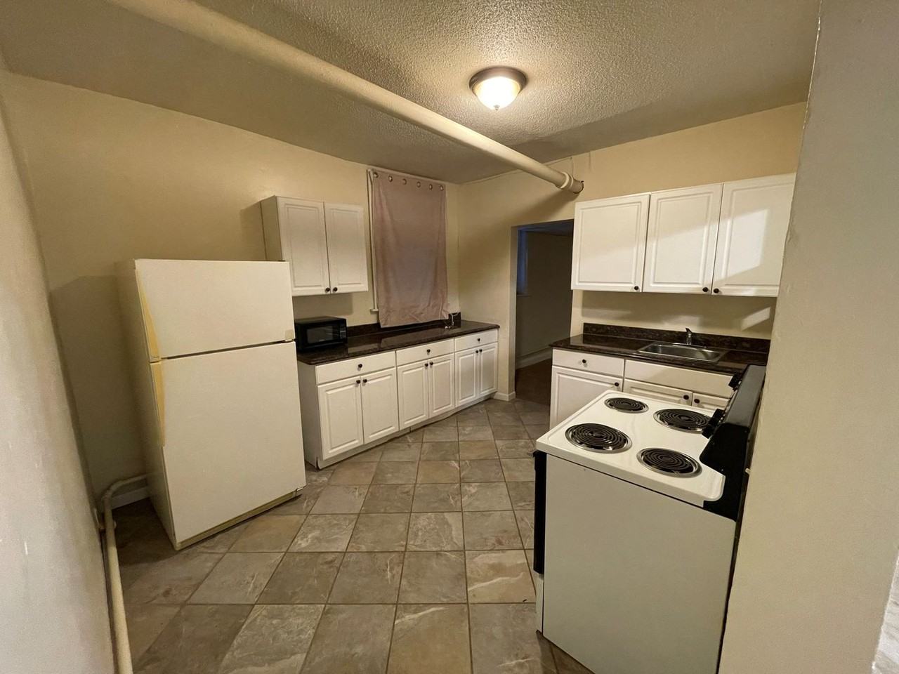 Spruce Place Apartments - Photo 2 of 6