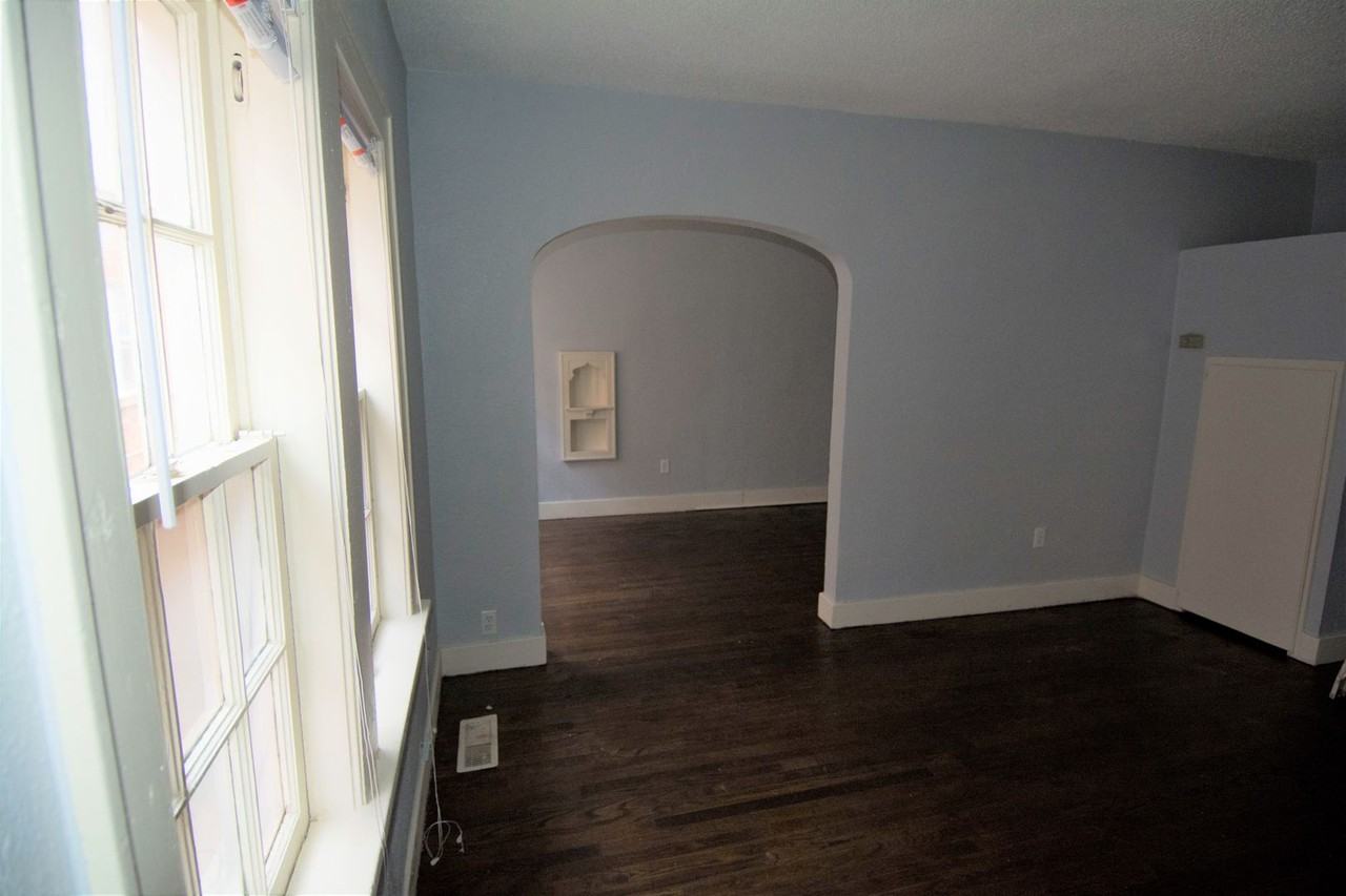 SUPER CUTE HISTORICAL PROPERTY! AFFORDABLE AND COZY - Photo 2 of 10