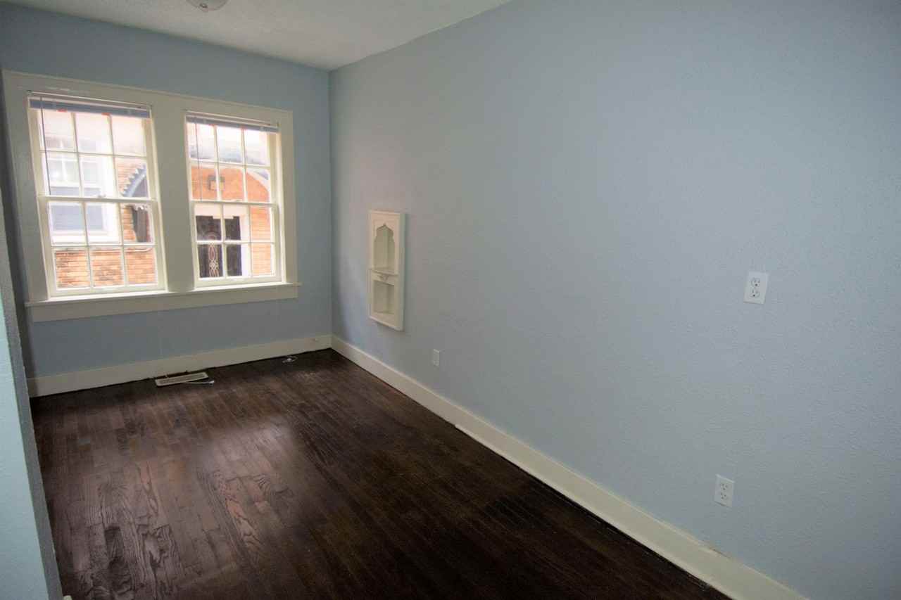 SUPER CUTE HISTORICAL PROPERTY! AFFORDABLE AND COZY - Photo 3 of 10