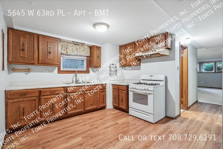 5645 W 63rd Pl #BMT - Photo 2 of 13