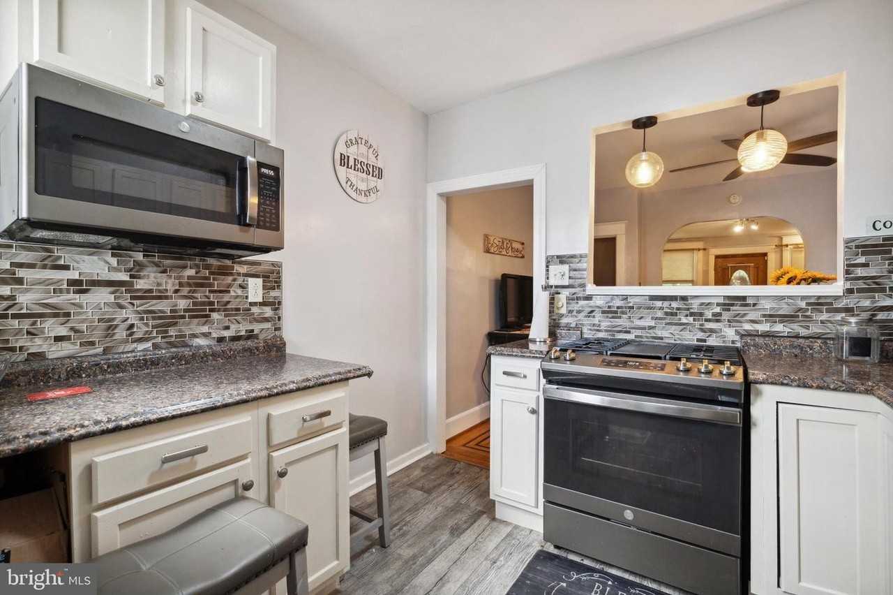 7117 Woolston Ave #NA - Photo 3 of 14