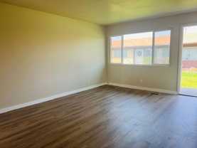 Beautiful single level town house for rent. New flooring and new paint throughout. Fenced Patio, Central Air, Carport. - Photo 1 of 1