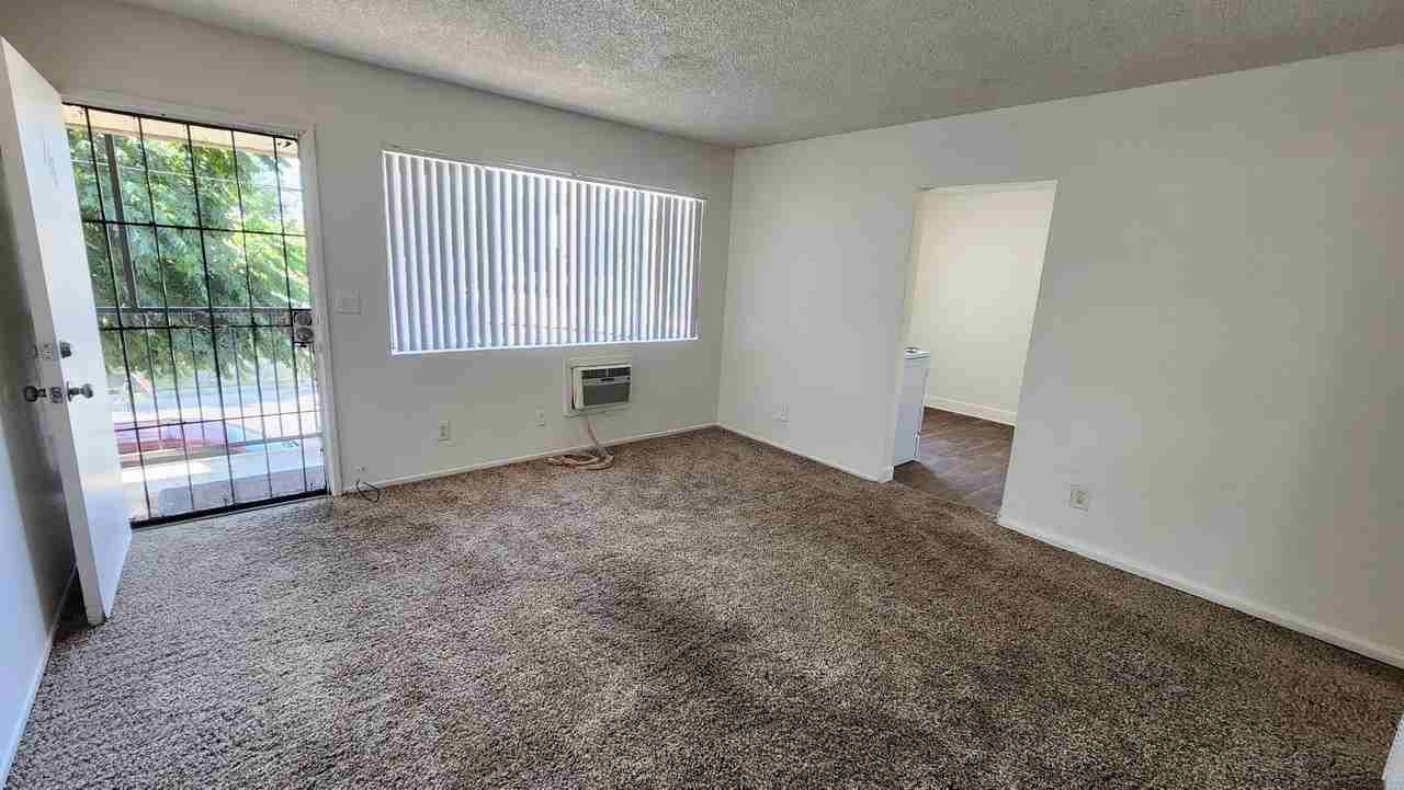 207-211 E 13th St - Photo 3 of 9